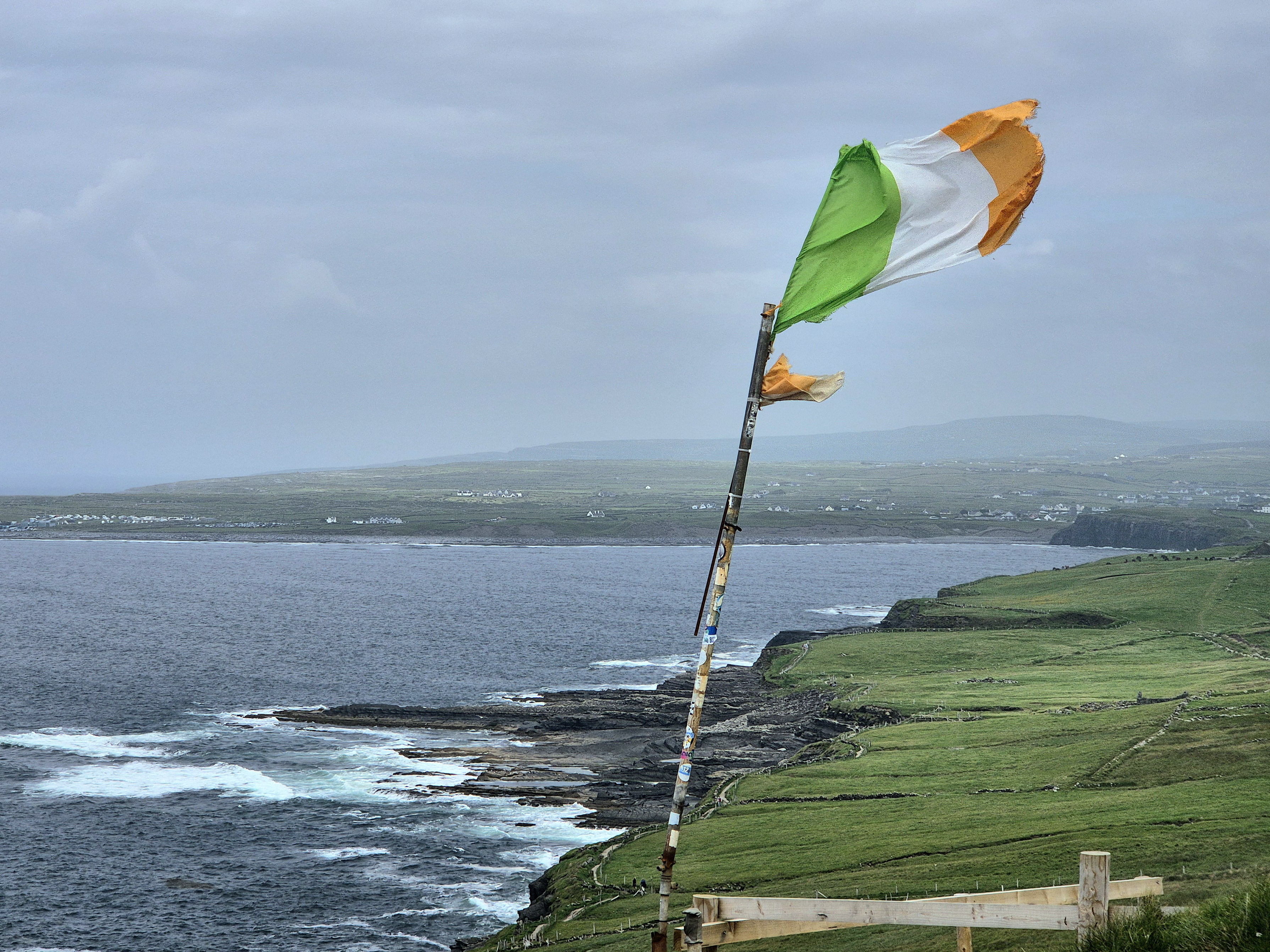 A view of an Irish flag and landscape