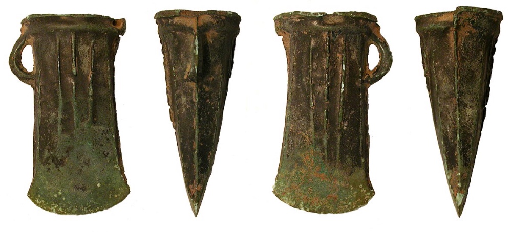 A collection of cast copper alloy axe heads and other metal fragments from the Late Bronze Age.